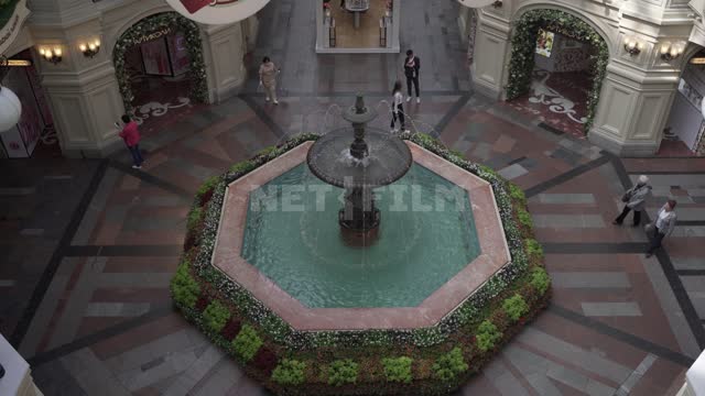 GUM, fountain on the first floor, top view GUM, fountain, water, landscaping, people, shoppers,...