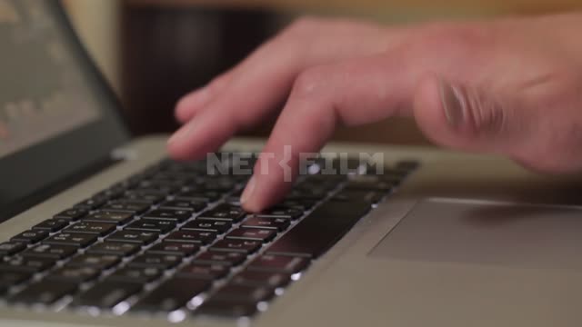 Man typing on laptop, hands close up Men's hands, fingers type, laptop, keyboard, touchpad