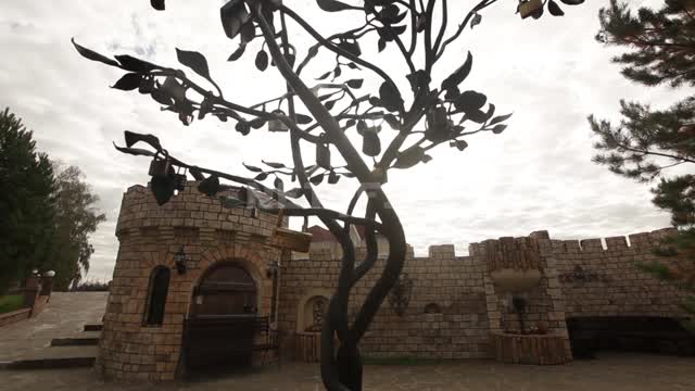 Cottage village, iron tree with locks on the branches Urban sculpture, metal, art forging,...