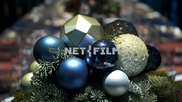 Preparation for the shooting of the New Year's program, a bouquet of Christmas balls on the table...