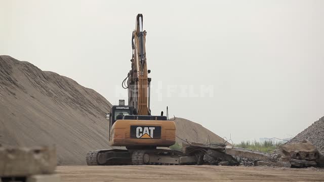 Two excavators are clearing the rubble Excavator, construction equipment, road equipment, blockage,...