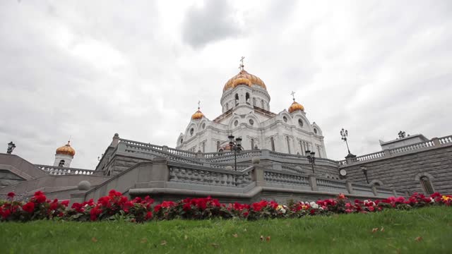 Blooming flower bed in front of the Cathedral of Christ the Savior Cathedral of Christ the Saviour,...