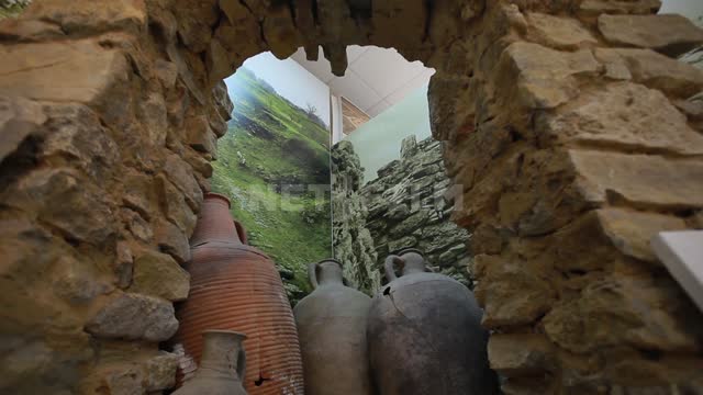 Tanais Museum-Reserve, stone arch, amphorae in the corner, close-up shot Tanais, museum,...