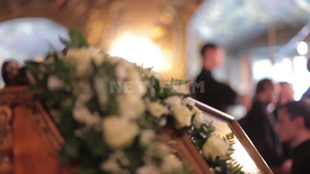 Trinity-St. Sergius Lavra, white flowers on the pulpit, switching focus to the Seminarians ' choir...