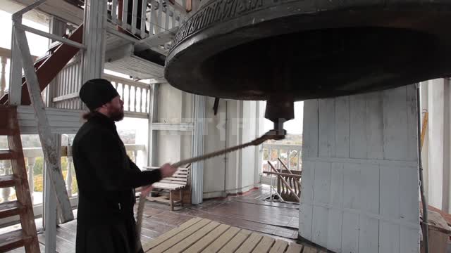 Trinity-St. Sergius Lavra, the priest rings the bell Trinity-Sergius Lavra, landmark, bell tower,...
