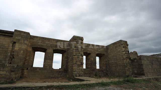 Derbent, clouds pass over the ancient fortress, an inside view Derbent, fortress, landmark, walls,...