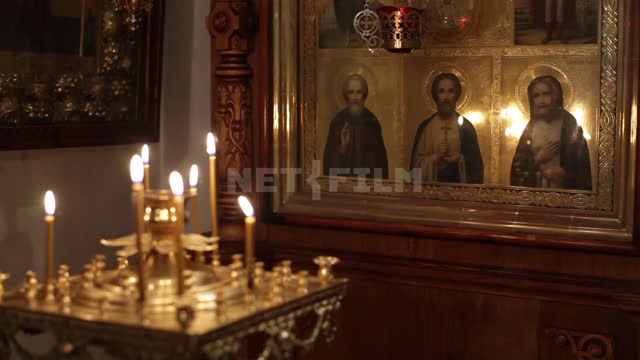 Yaroslavl, the interior of the church, the altar with burning candles in front of icons Yaroslavl,...
