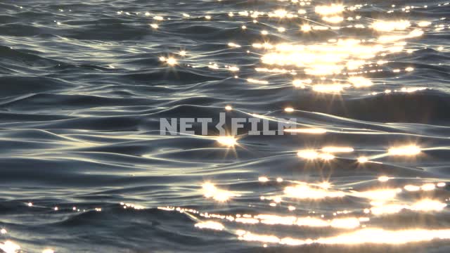 The sun sparkles on the water, splashes of waves in the sun's rays Sea, nature, summer, landscapes,...