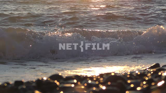 Sea surf in the rays of the setting sun, bokeh on the rocks Sea, nature, summer, landscapes,...