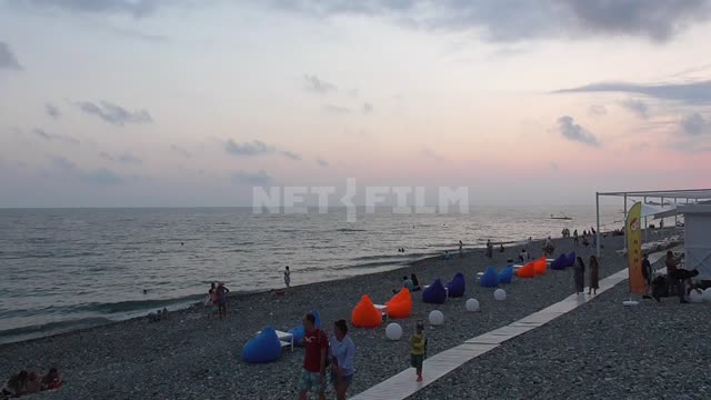 Olympic embankment of the black sea, along the shore of the walking people Black, sea, wave,...