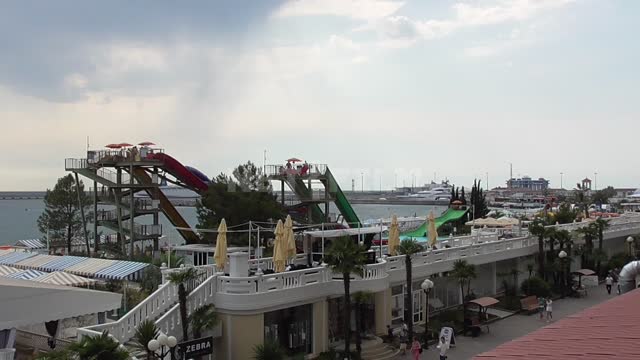 View from the top of the water park located on the background of the Black Sea, slides, embankment...
