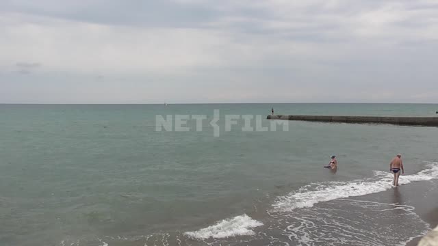 Black Sea, people swim in the sea The black sea, wave, tourist, holiday, vacation