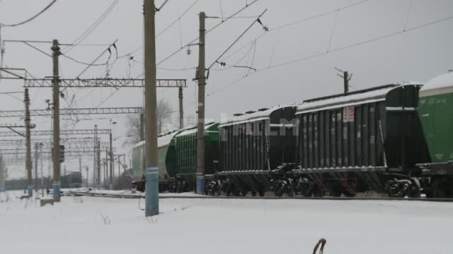 Freight cars stand at the railway station Winter, railway, road, station, freight, train, wagon,...