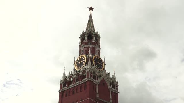 Spasskaya Tower against the background of clouds on a cloudy day Kremlin, Spasskaya Tower, clock,...