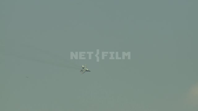Two planes in the sky performing aerobatics.
Simulated combat. Fighter aircraft