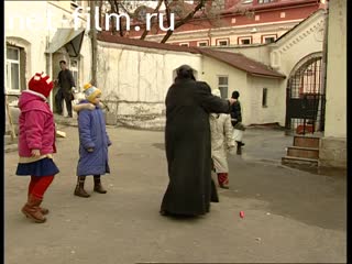 Footage Children play outside in the courtyard of the church in Moscow. (2004)