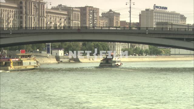 Boats floating on the Moscow river Ship
The Moscow river.
The waterbus
Bridge
The high-rise.
The...