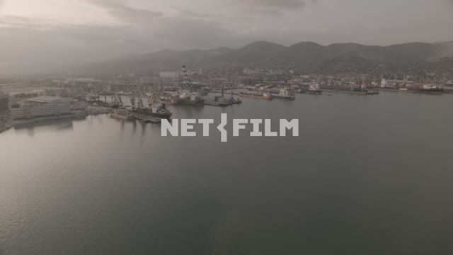 Aerial photo of Novorossiysk sea port The aerial photo.
Panorama.
Sunny day.
Cloudy
Mountains.
The...
