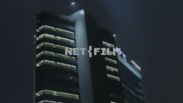 High-rise building at night. The city.
Architecture.
The light in the Windows.
Night.
Winter.