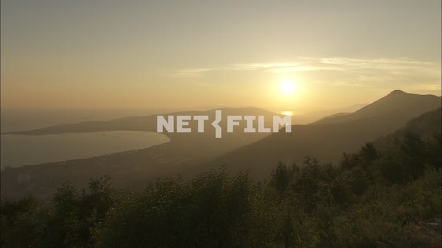 Views of the sea and mountains at sunset Nature.
Panorama.
The sky.
The sun
Yellow...