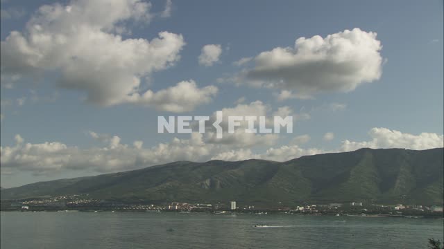 The coast of the Black sea mountains in the background Nature.
Panorama.
The sky.
Sea.
Trees.
The...