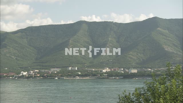 The coast of the Black sea mountains in the background Nature.
Panorama.
The sky.
Sea.
Trees.
The...