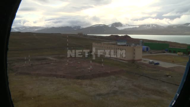 Shooting through the window of the helicopter on the pad. Russian North, illuminator, helicopter,...