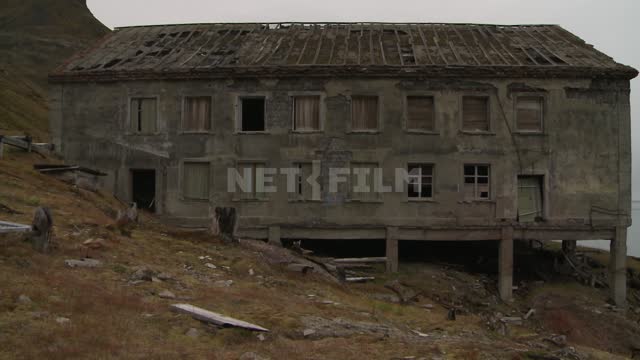 Panorama of the coast and abandoned buildings on stilts. Russian North, knowledge, ruins, piles,...