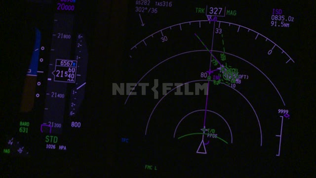 Glowing instrument panel in the cockpit, night flight. Russian North, equipment, scale, airplane,...