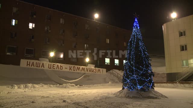 Christmas tree in the town square. Russian North, Christmas tree, holiday, New Year, garlands,...