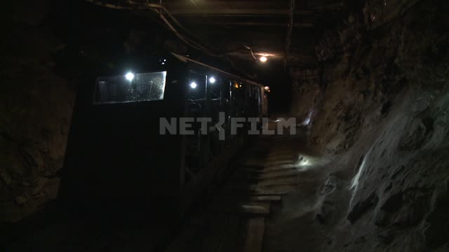 The miners are sitting in the passenger trolley in the tunnel. Russian North, miner, mine, mine,...