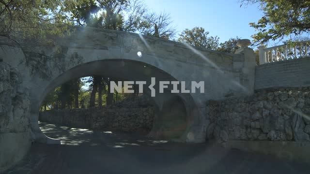 Stone bridge over the road. Sevastopol.
Bridge.
Park.
Summer.
Day.
Road.
Arch.
Stones.