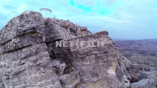Quadcopter with camera flies over the Klementiev mount and flies to the rotunda. Koktebel, aerial...
