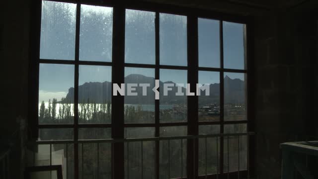 The view through the window on the village, the mountains, the sea and vegetation. Koktebel,...