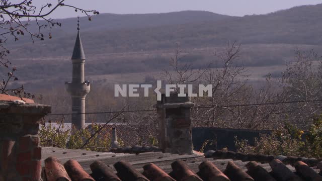 View of the minaret with a tiled roof. Koktebel, minaret, tile, pipe, house, mountains, hills,...