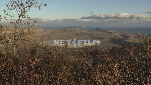 Top view of lake Barkol and plain. Koktebel, lake, hill, grass, tree, plain, clouds, sea,...