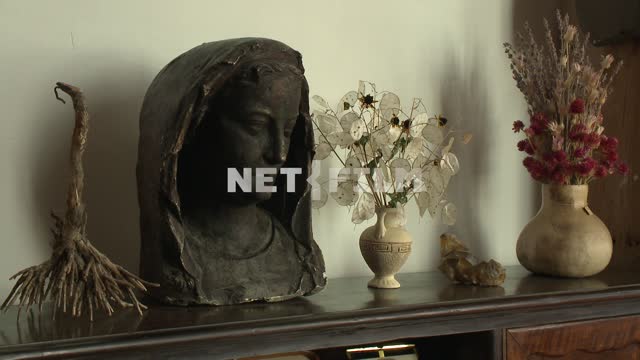 Bronze bust of a girl and a vase with dried flowers in the house-Museum M. A. Voloshin Koktebel,...