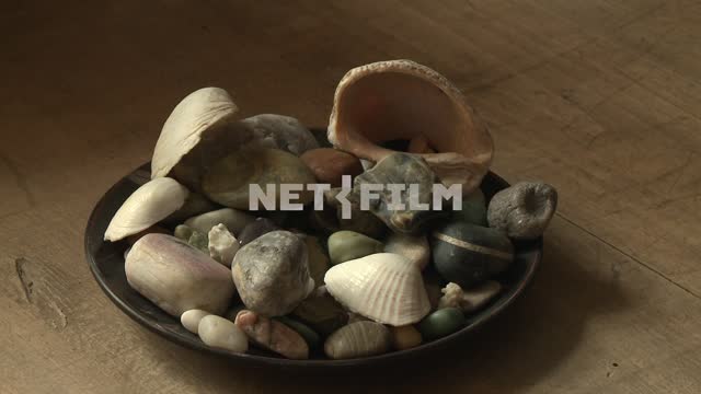 Dish with shells and sea pebbles on the table of M. A. Voloshin Koktebel, stones, pebbles, shells,...