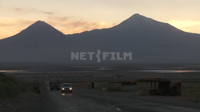 Cars driving on the road on the background of mount Ararat...