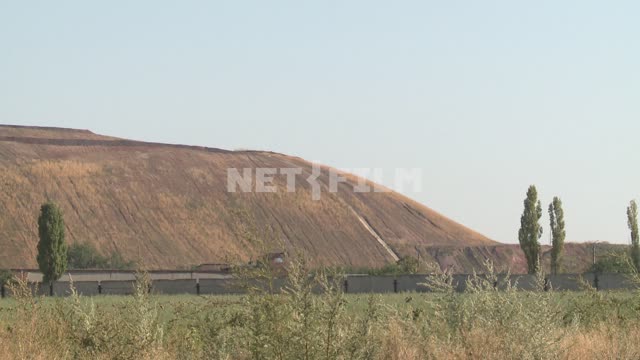 Hill slag heap in the desert. Waste heap, hill, mine, coal, dump, steppe.