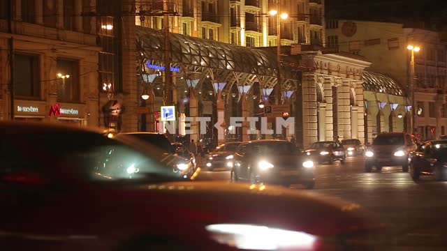 Cars driving on Tverskaya street, past the Ritz-Carlton. Tverskaya street
Car...