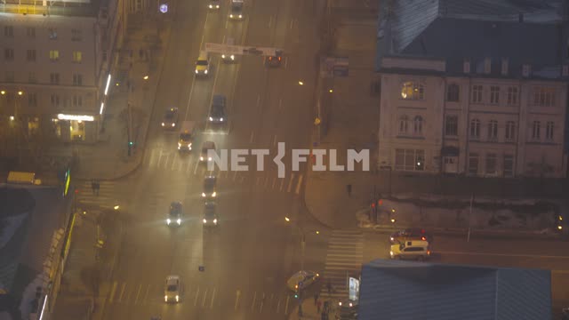Vehicles moving through the intersection, the view from the top.
Machine, night, top view....
